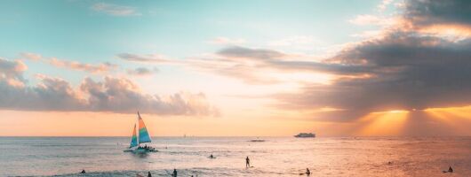 Board from Waikiki Beach for a scenic Sunset Sail on the Hāwea
