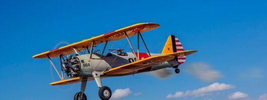 Historical Flight Adventure in an Open Cockpit Biplane From WWII 