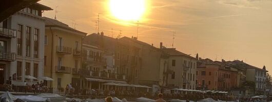 Sup experience with a ride to Peschiera del Garda Lake Garda