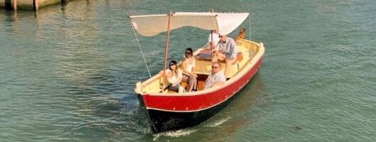 Sunset in a typical boat in Venice